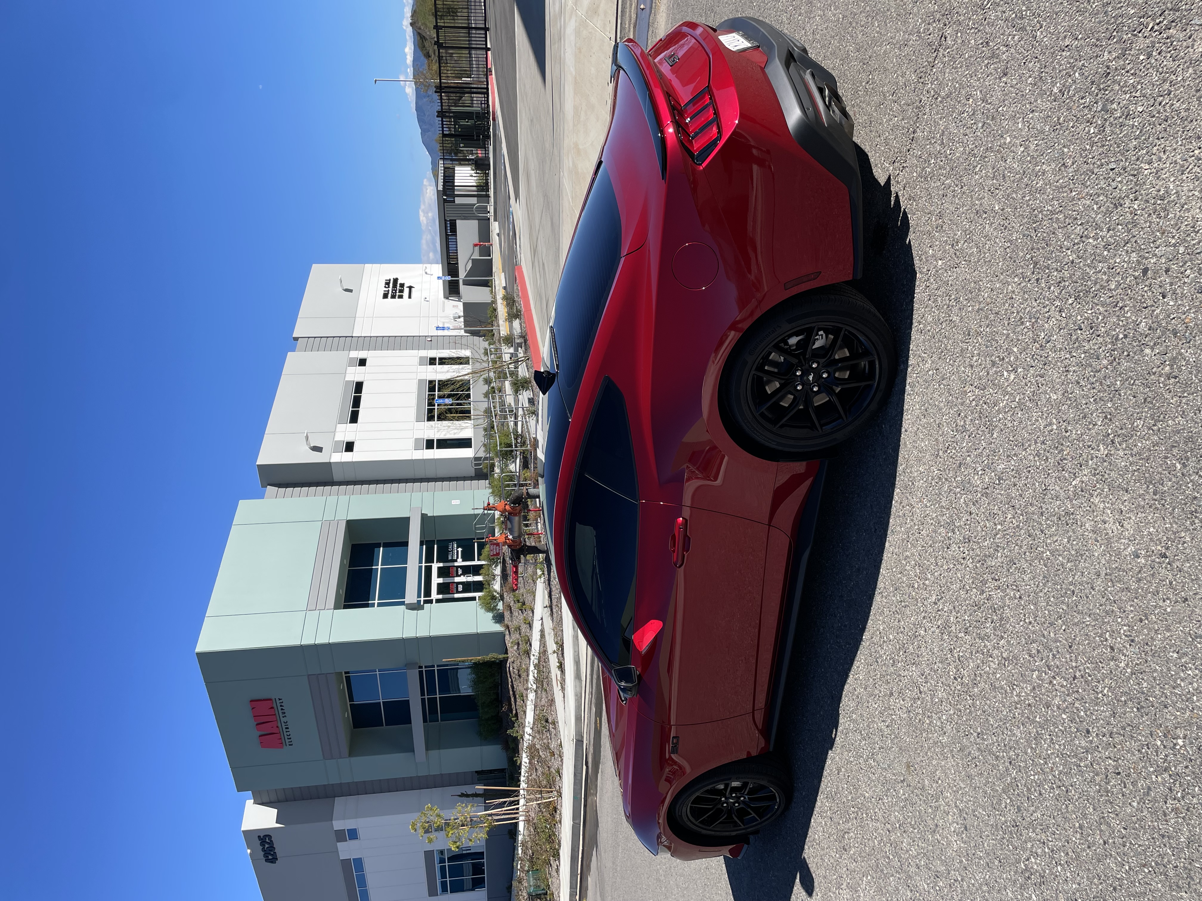 Red car with dark tint